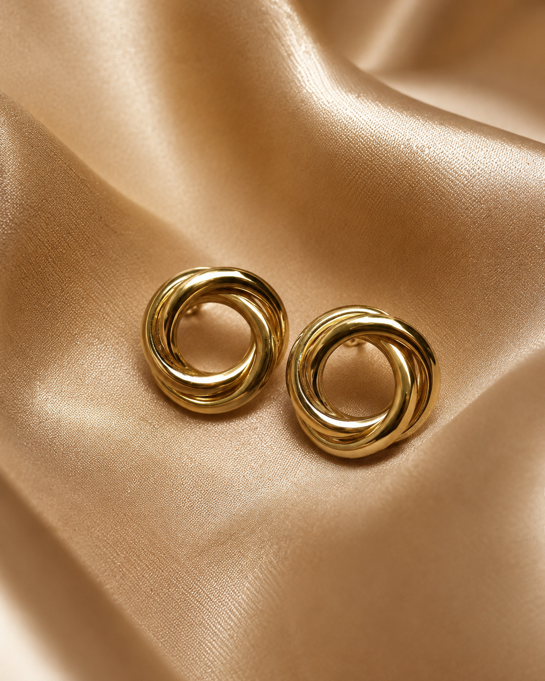 Gold-plated interlocked knot stud earrings