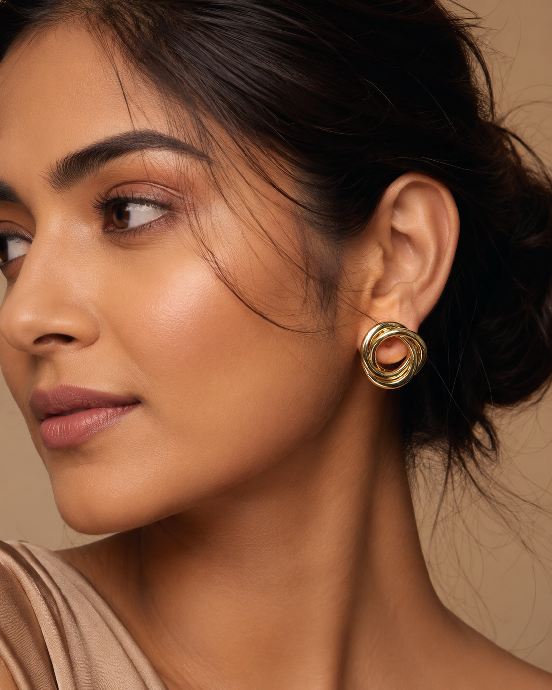 Gold-plated interlocked knot stud earrings